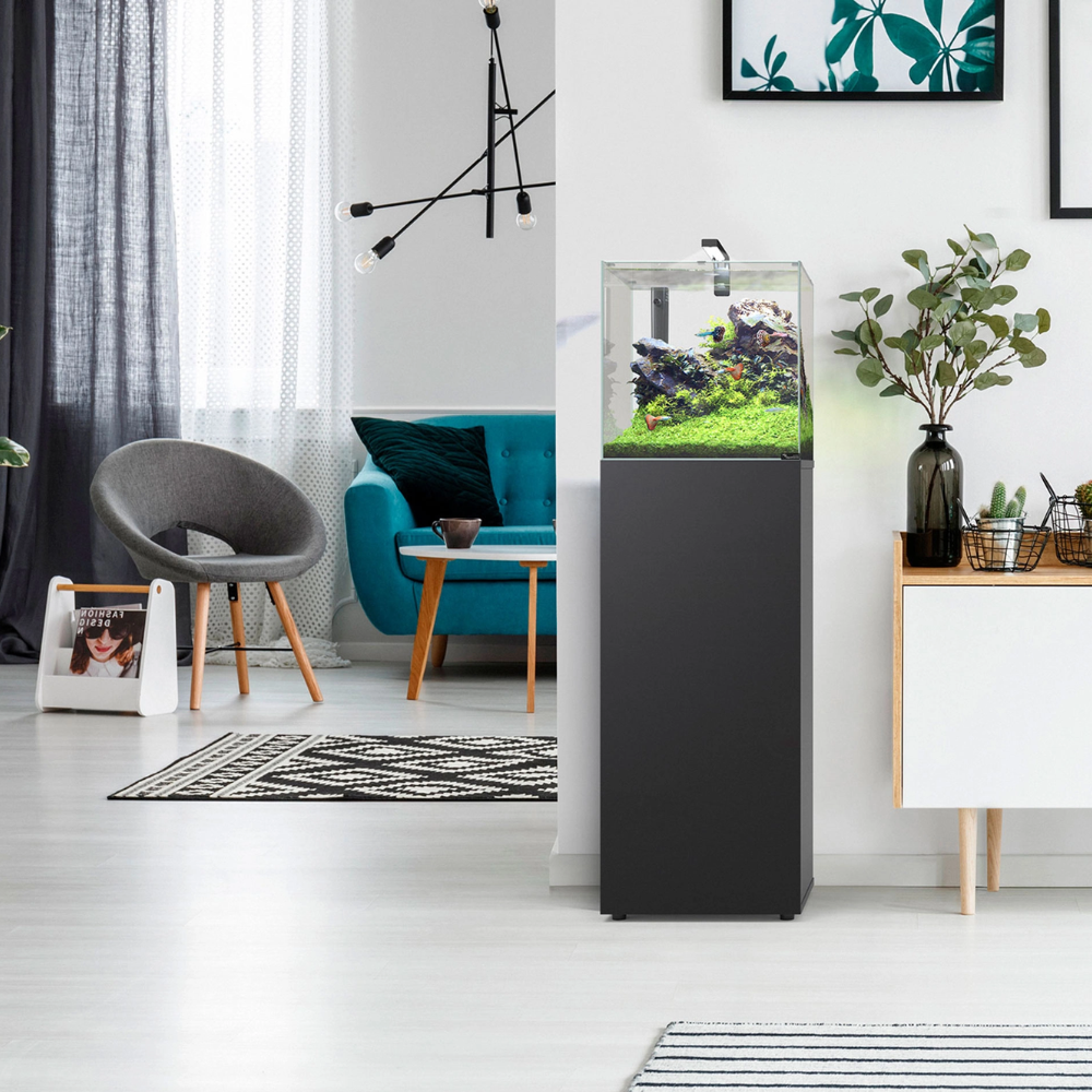 Modern living room with a black fish tank on a white floor.
